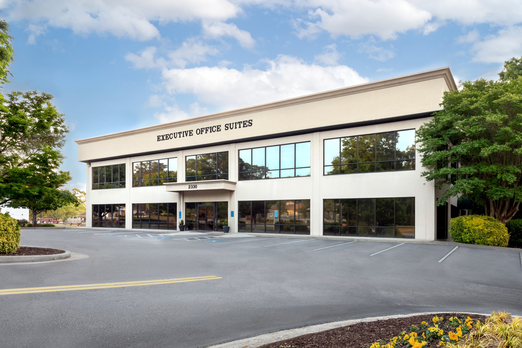Scenic Office Suites building at 2330 Scenic Hwy S in Snellville, GA, with the front entrance, signage, and parking visible
