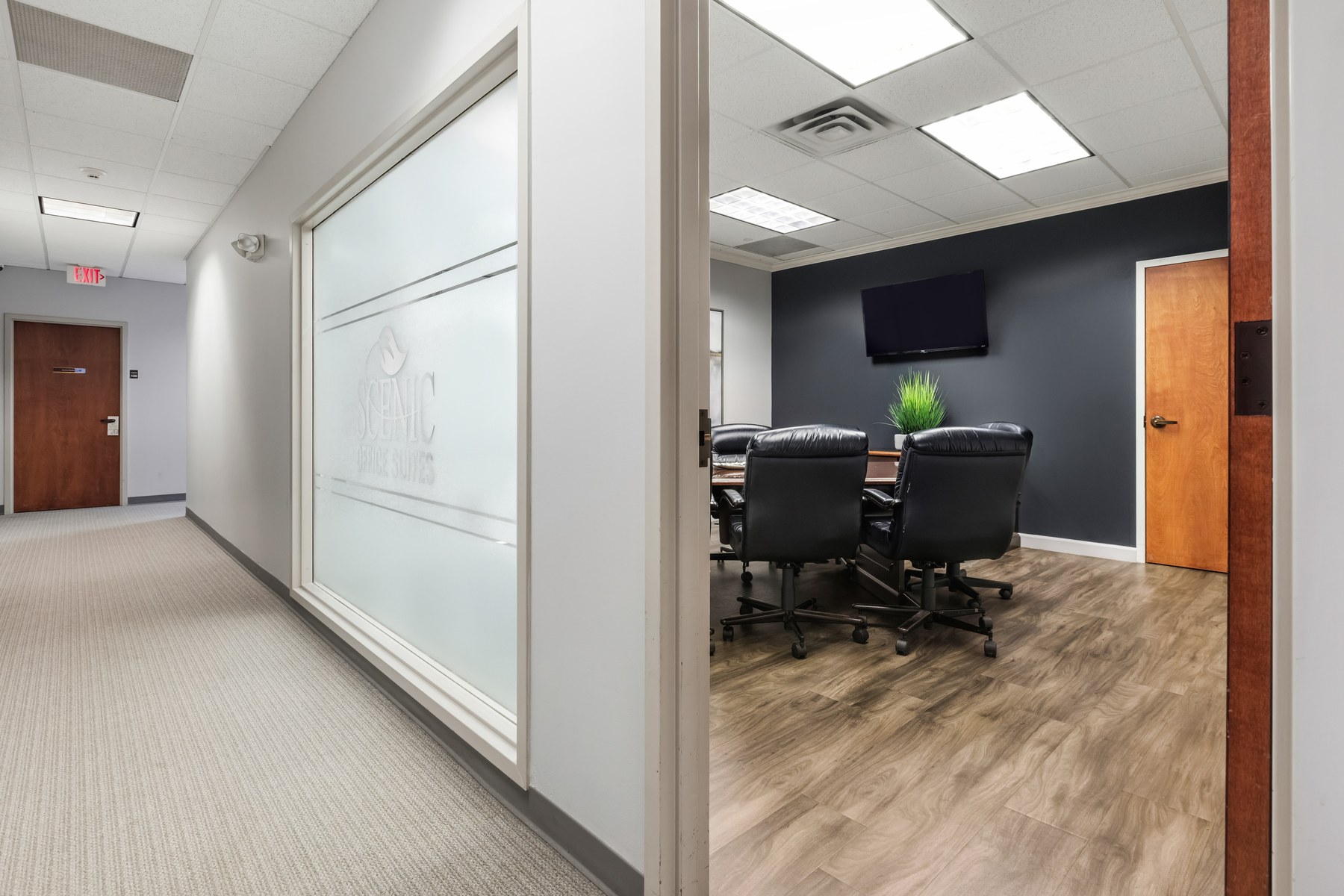 Common hallway at Scenic Office Suites with seating and decor