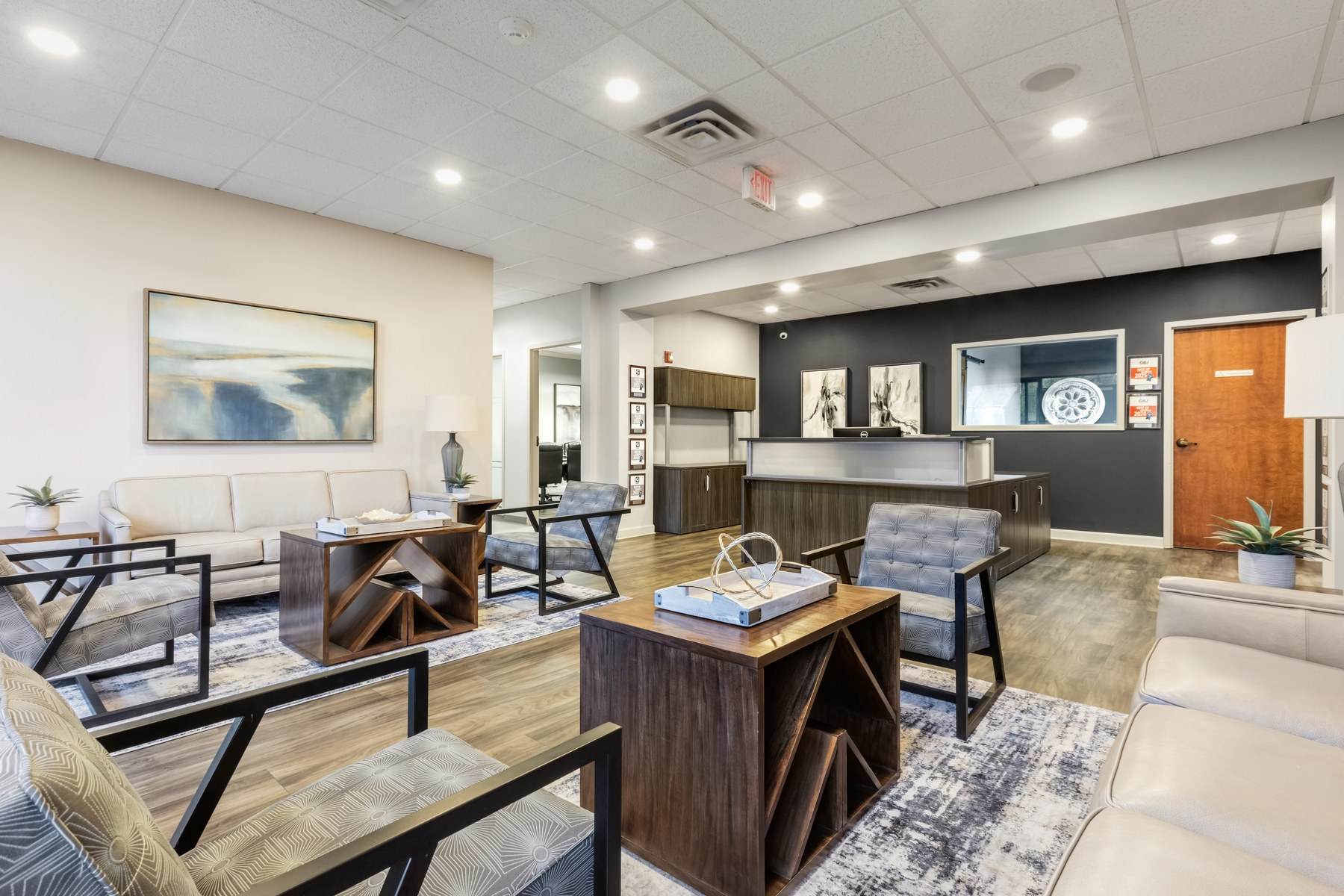 Lobby and reception area at Scenic Office Suites with seating, natural light, and the tenant directory