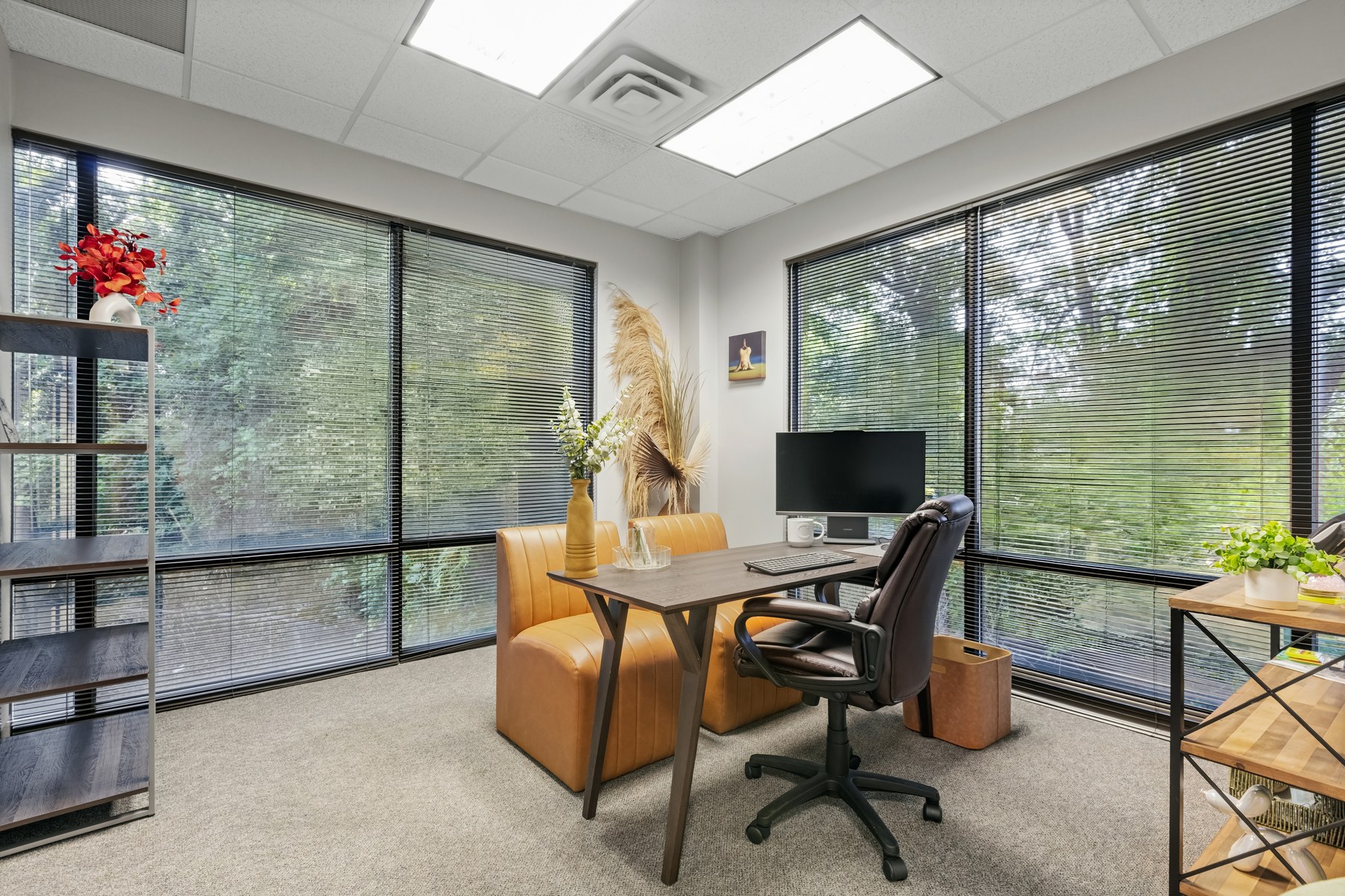 Furnished private office at Scenic Office Suites with desk, dual monitors, ergonomic chair, and natural light